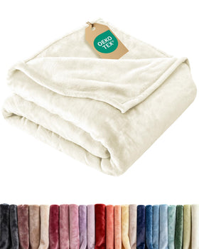 CGK Unlimited ultra soft fleece blanket on bed shows plush comfort for all seasons.