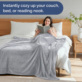 CGK Unlimited Ultra Soft Fleece Twin blanket on bed with stylish drape.