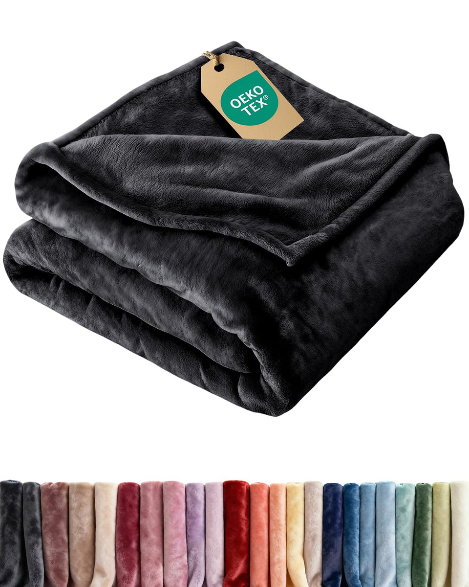 CGK Unlimited ultra soft fleece blanket twin size on couch for all-season comfort.
