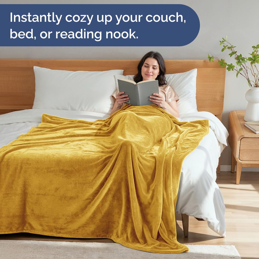 CGK Unlimited versatile blanket on couch demonstrates easy lounging and styling versatility.