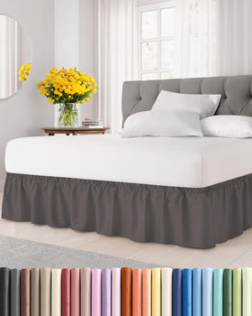 CGK Unlimited wrap-around bed skirt in dark grey on a queen bed for a polished look.