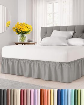 CGK Unlimited wrap-around bed skirt in light grey on a king bed with 12-inch drop.