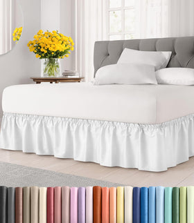 CGK Unlimited wrap-around bed skirt in white on full bed with 12-inch drop.