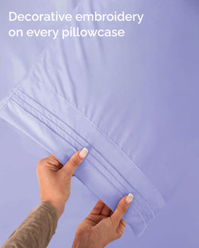 Bedroom setup demonstrates wrinkle-free drape and easy-fit bedding.