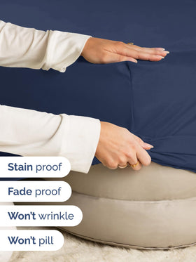 CGK Unlimited wrinkle-resistant navy blue fitted sheet maintains smooth appearance.