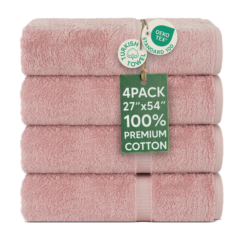 Chakir Turkish Linens 4-piece pink bath towel set in bathroom for spa-like comfort.