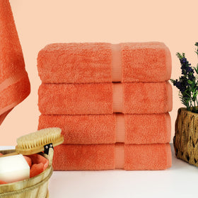 Chakir Turkish Linens coral towels closeup shows plush cotton weave for luxurious absorbency.