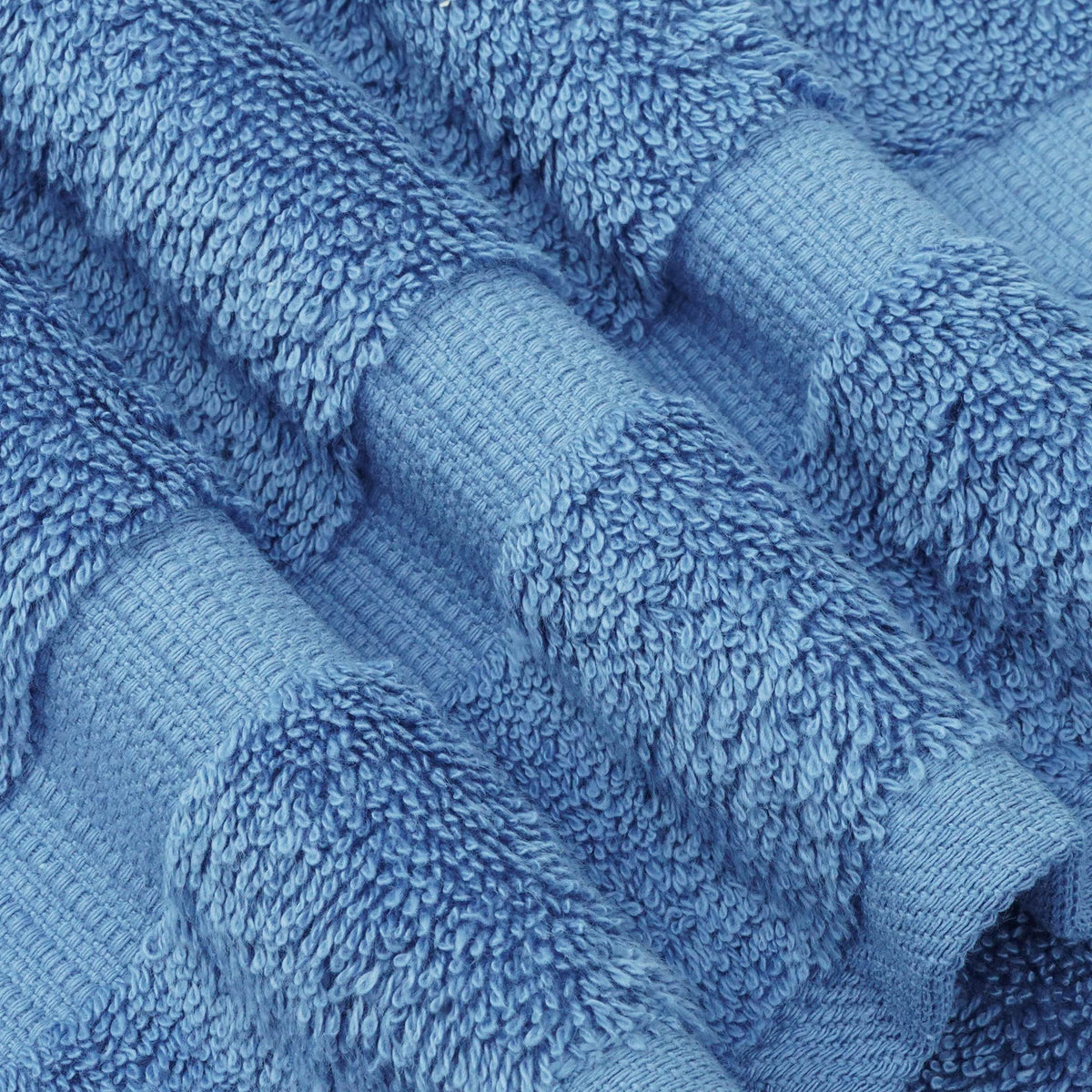 Chakir Turkish Linens wedgewood towel demonstrating high absorbency after washing.