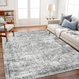 Champlant 8x10 gray vintage area rug with soft pile and distressed floral pattern.
