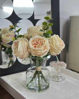 CHASMILE champagne roses in vase stable glass vase enhances upscale table setting.