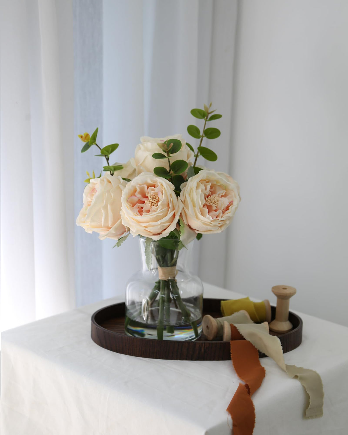CHASMILE champagne roses in vase water-filled display for maintenance-free decor.