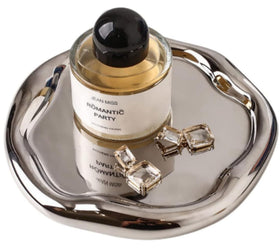 CHENDECOR silver tray on a vanity displaying a jewelry setup and daily essentials