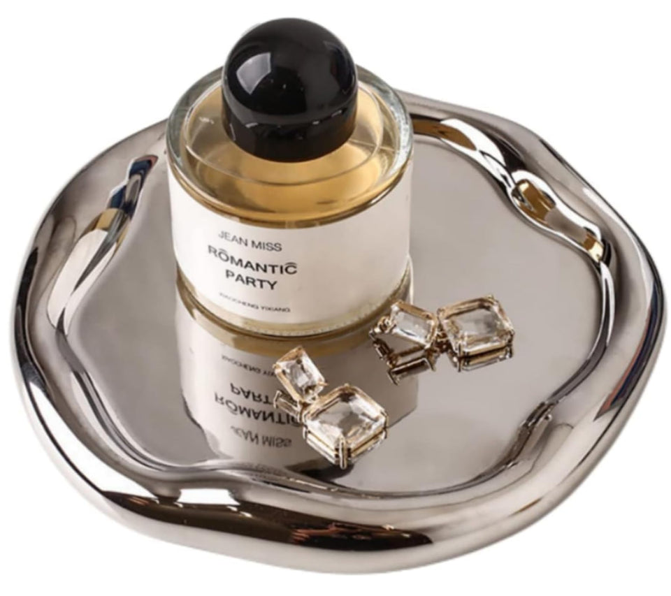 CHENDECOR silver tray on a vanity displaying a jewelry setup and daily essentials
