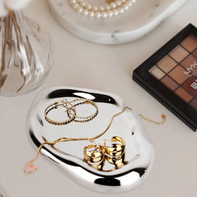 CHENDECOR silver tray dresser vanity display organizes cosmetics and keys.