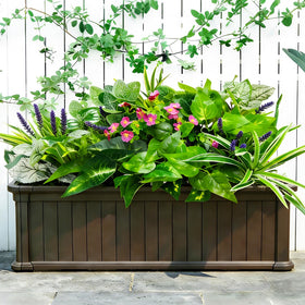 Cherica entryway garden display using fake plants for year-round greenery
