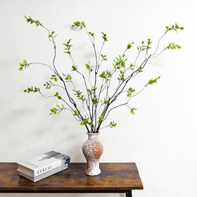 Cherica living room decor using long faux ficus stems.