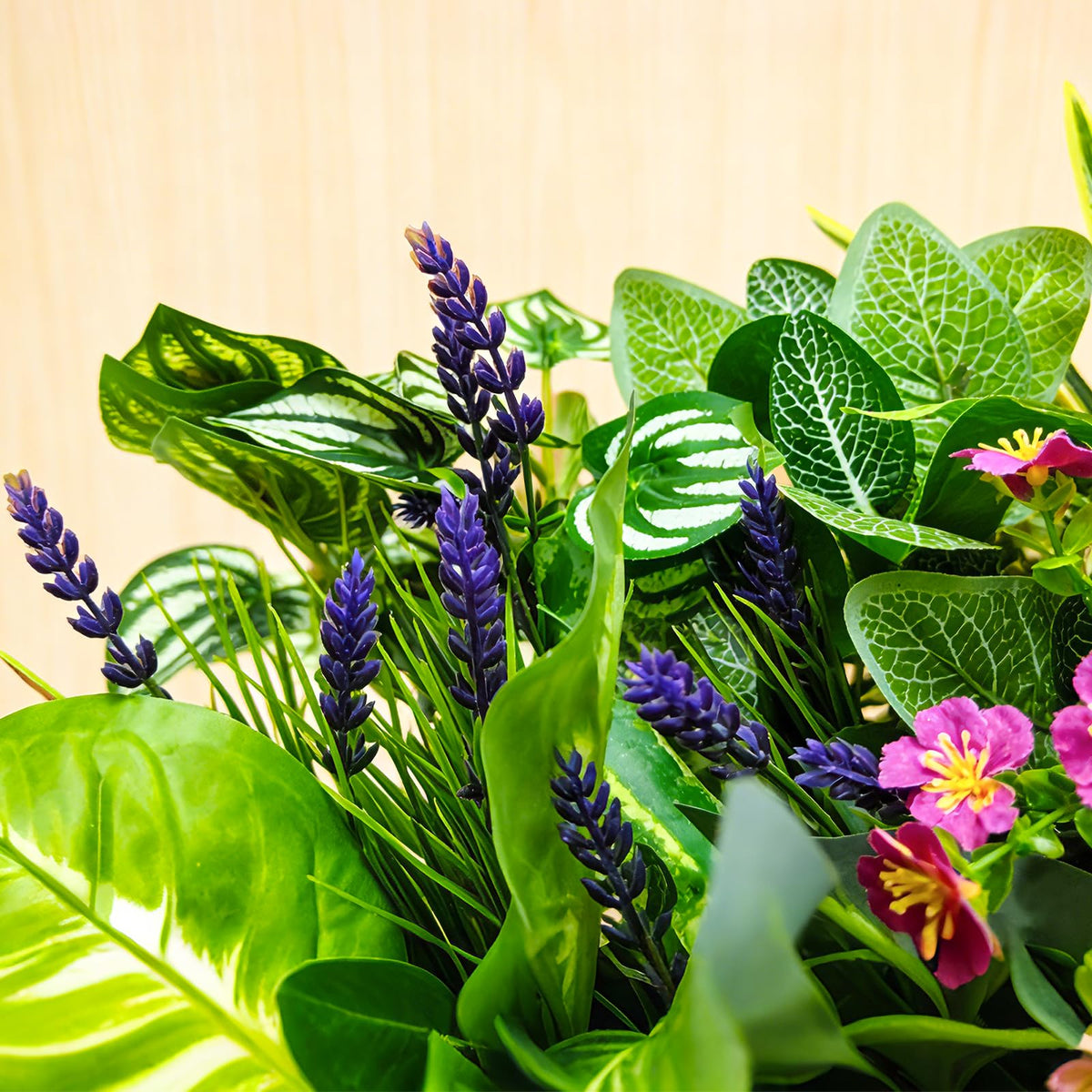 Cherica faux greenery with floral accents enhancing a balcony with color