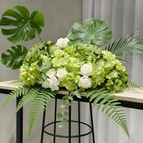 Cherica wedding centerpiece using realistic hydrangea blooms.