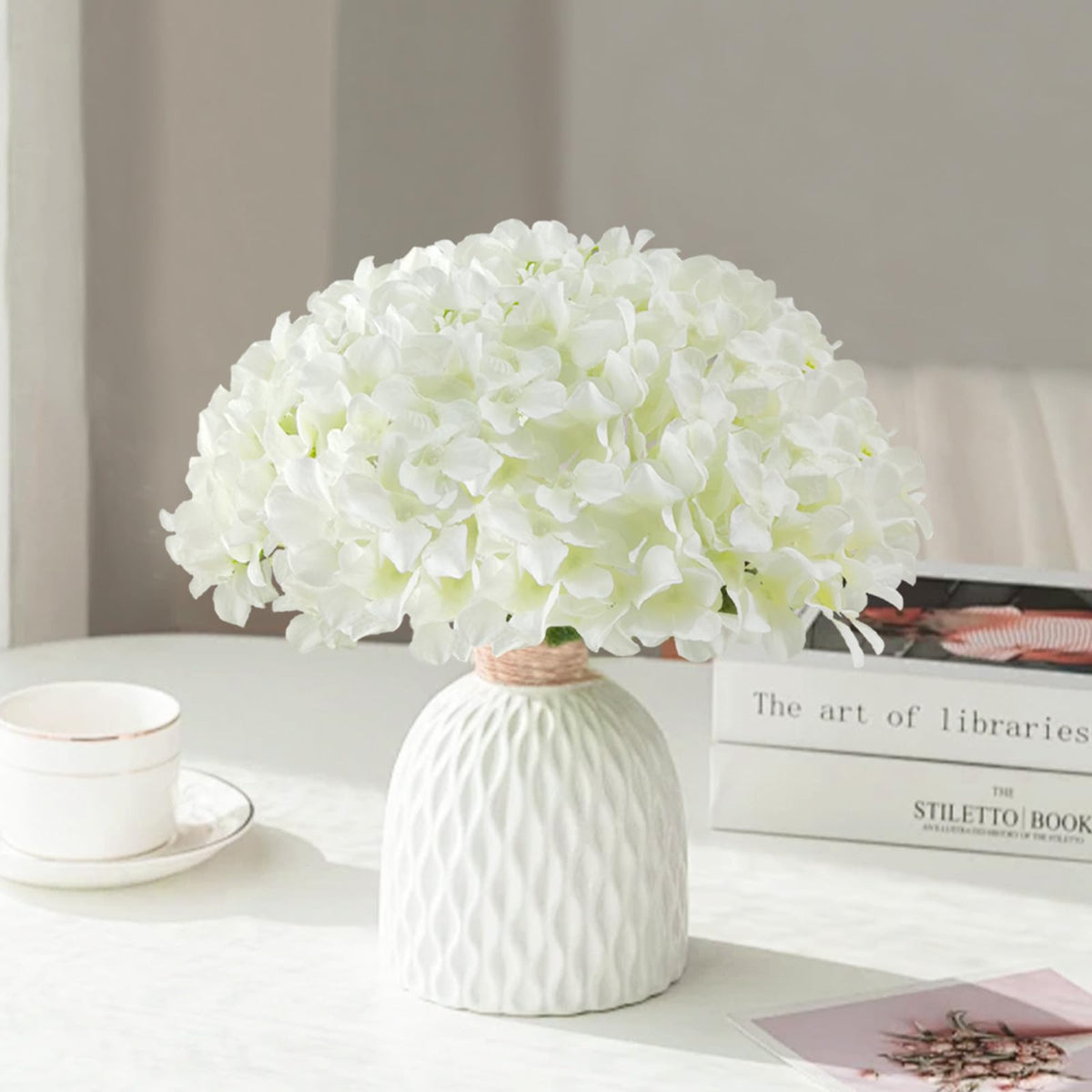 Cherica artificial hydrangea stems with removable pieces for flexible decorating.