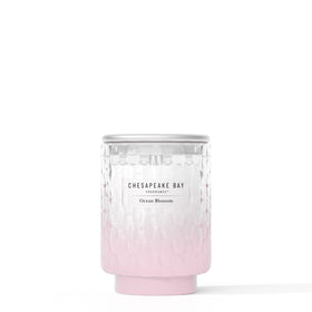 Chesapeake Bay Ocean Blossom candle jar with sea-glass texture enhances coastal decor.
