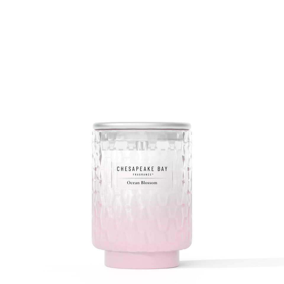 Chesapeake Bay Ocean Blossom candle jar with sea-glass texture enhances coastal decor.