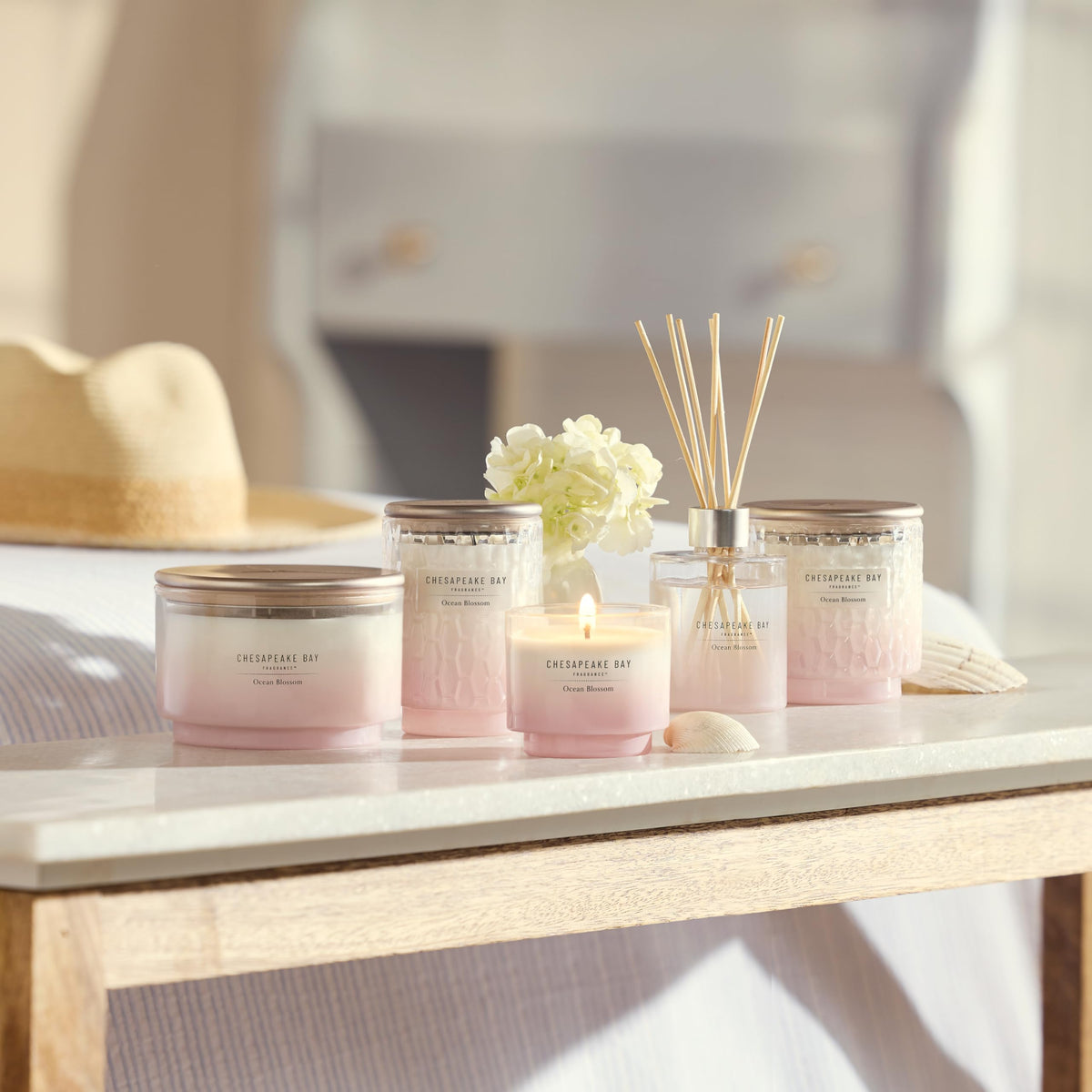 Chesapeake Bay Ocean Blossom candle shown in unboxing-style reveal.