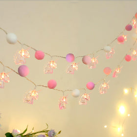ChiRee unicorn pom-pom lights create a cozy bedroom ambience.