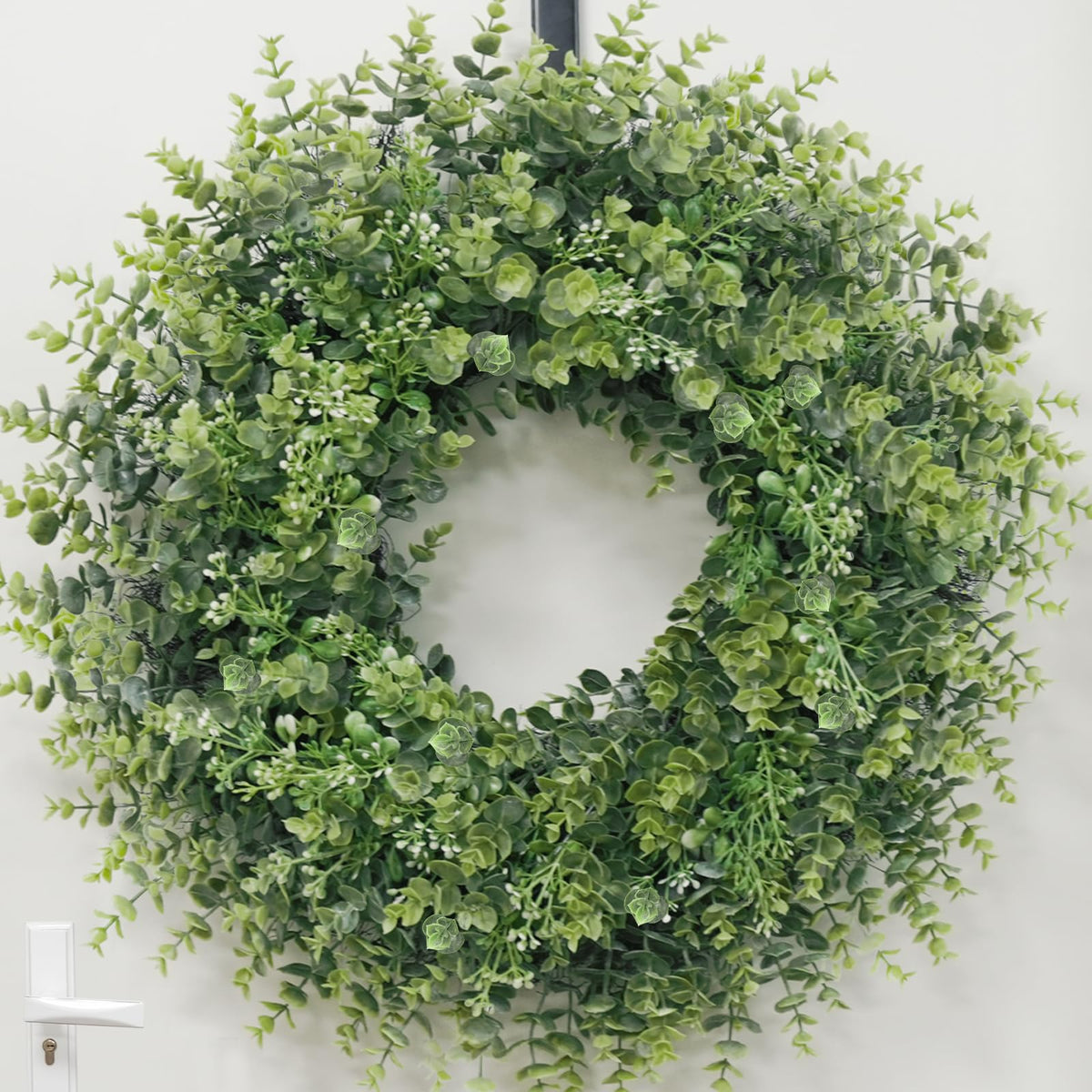 Chiyinbao boxwood wreath on window adds year-round charm.