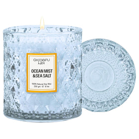 Chloefu LAN Ocean Candle in blue glass jar provides coastal decor and gentle fragrance.