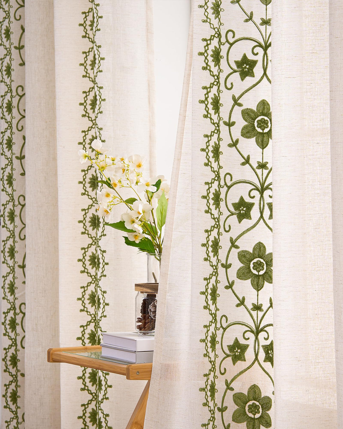 Chorowl Sage Green boho curtains embroidery closeup highlighting floral detail.