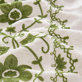 Chorowl Sage Green drapes in living room with natural light.