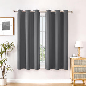 ChrisDowa blackout curtains 63-inch two-panel set in bedroom view, modern and minimal.