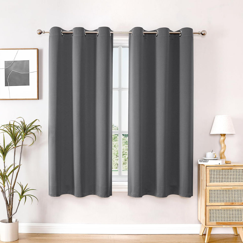 ChrisDowa blackout curtains 63-inch two-panel set in bedroom view, modern and minimal.