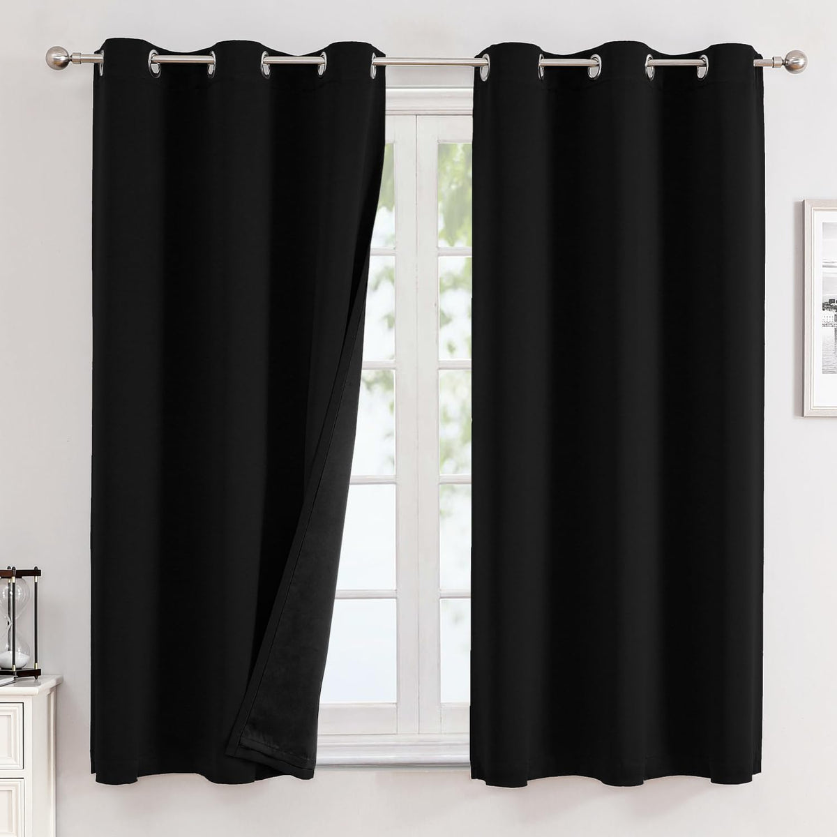 ChrisDowa blackout curtains two-panel setup for a sleek, darkened room and improved evening privacy