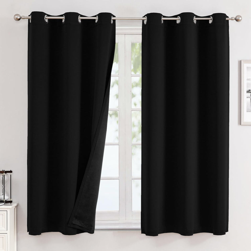 ChrisDowa blackout curtains two-panel setup for a sleek, darkened room and improved evening privacy