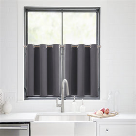 ChrisDowa dark grey fabric curtains displayed on a window for a sleek look