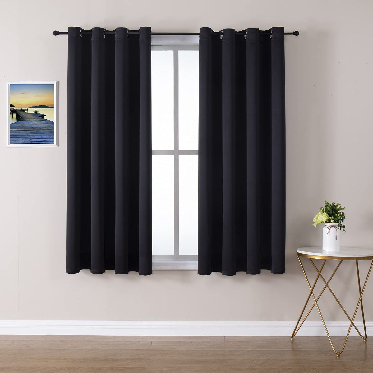 ChrisDowa grommet blackout curtains in a bedroom setup blocking light for deep sleep.