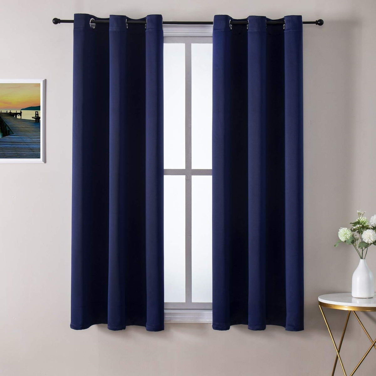 ChrisDowa grommet blackout curtains in navy block light for better sleep.