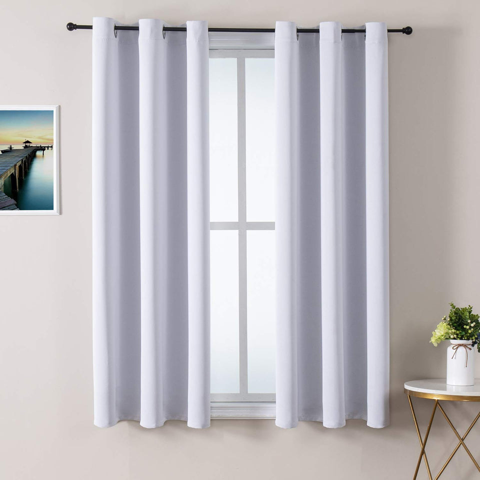 ChrisDowa grommet curtains two-panel setup ready to hang on living room windows