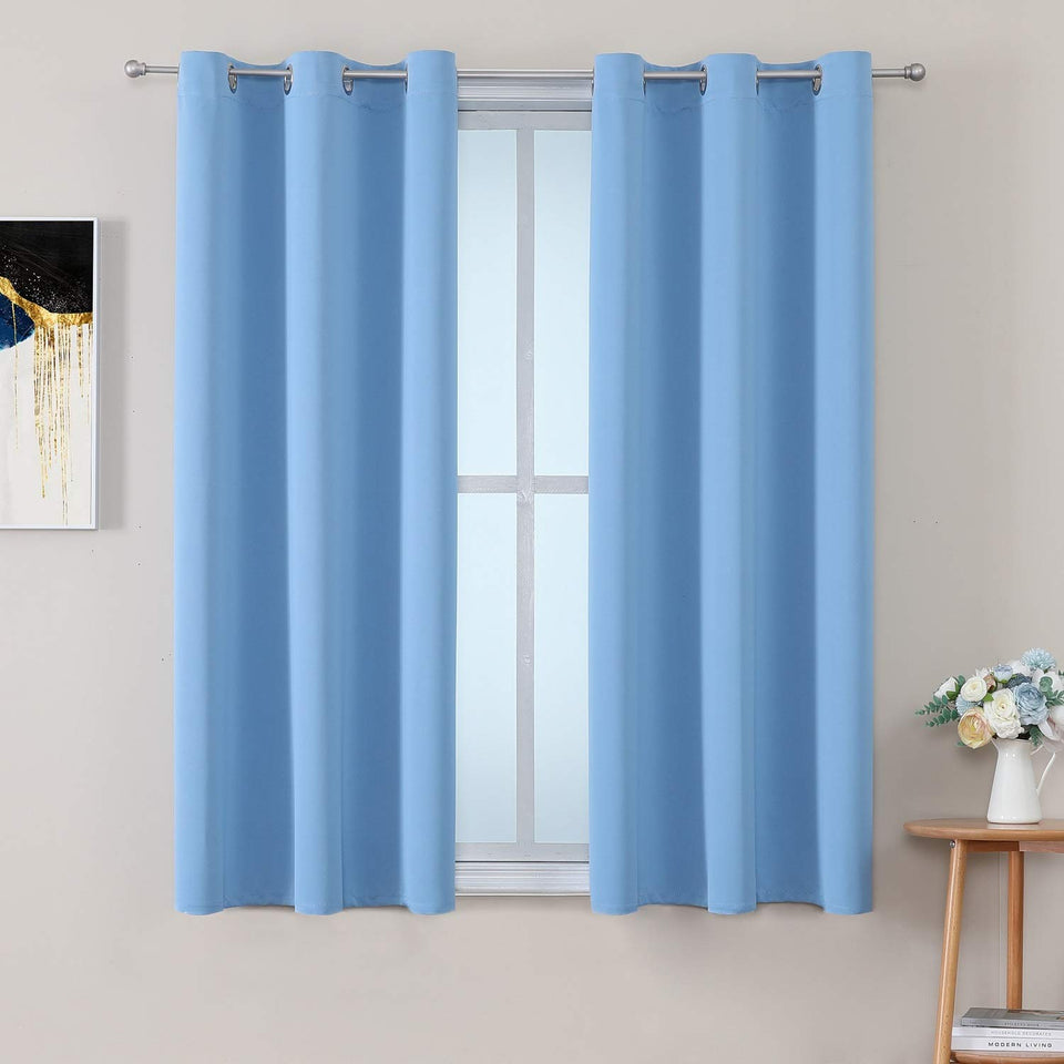 ChrisDowa grommet curtains sky blue panel blocks sunlight and adds soft texture.