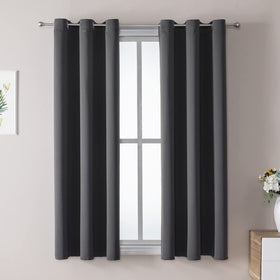 ChrisDowa grommet curtains with a two-panel set, blocking light for a darker bedroom.
