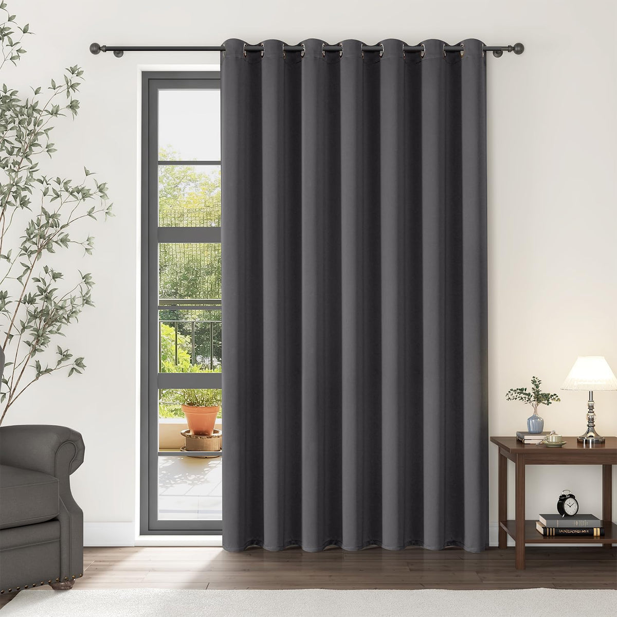 ChrisDowa room divider curtain in dark grey blocks light for added privacy.