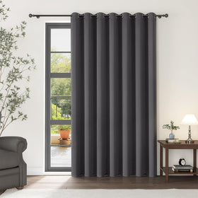 ChrisDowa room divider curtain in dark grey blocks light for added privacy.