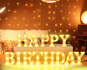 CHUNNIN Happy Birthday marquee letters glow warmly for tabletop celebrations.