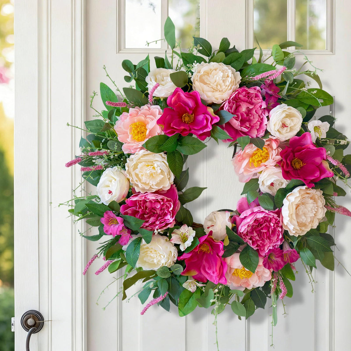CHvista handcrafted silk blooms on a grapevine base with premium detail.