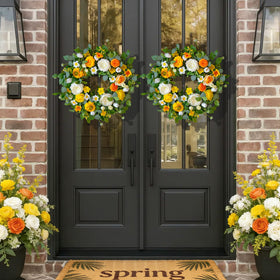 CHvista Spring Wreath showcases small white blooms among lush greenery