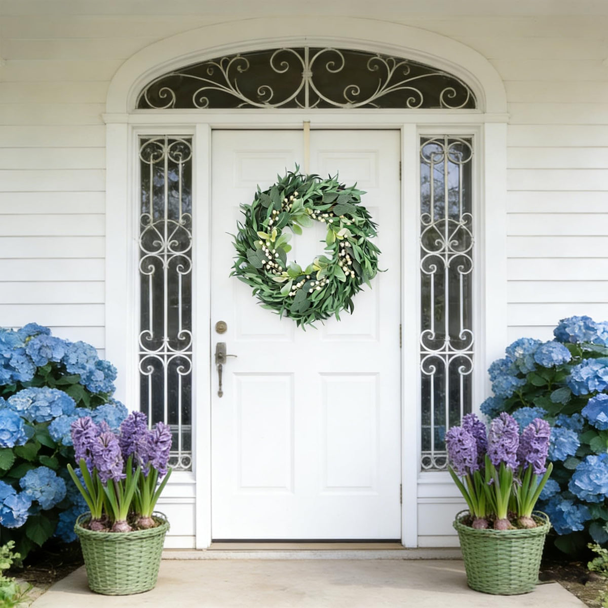 CIR OASES wreath with white berries provides delicate contrast for seasonal styling.