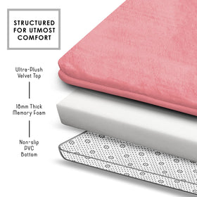 Clara Clark memory foam pink bath mat cushions feet during post-shower steps.