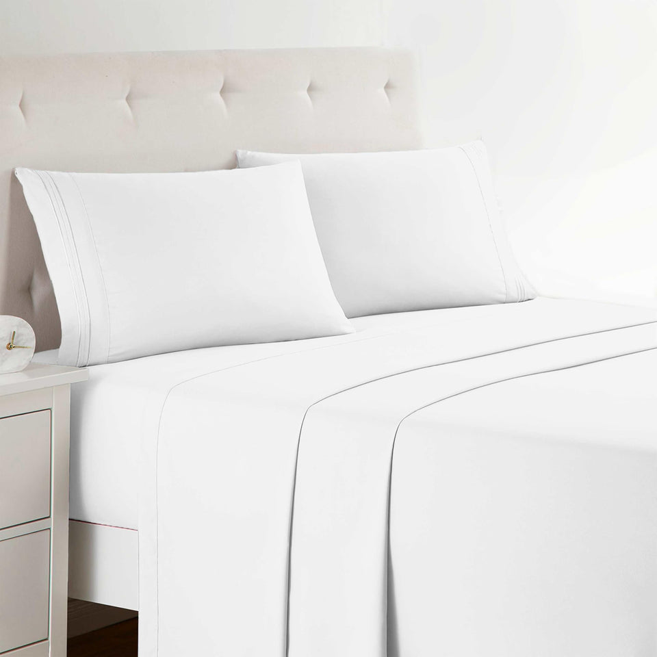 Clara Clark Premier 1800 series four-piece sheet set on a pristine bed showing luxurious bedding