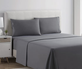 Clara Clark Premier 1800 fitted sheet in charcoal demonstrates deep-pocket fit for tall mattresses